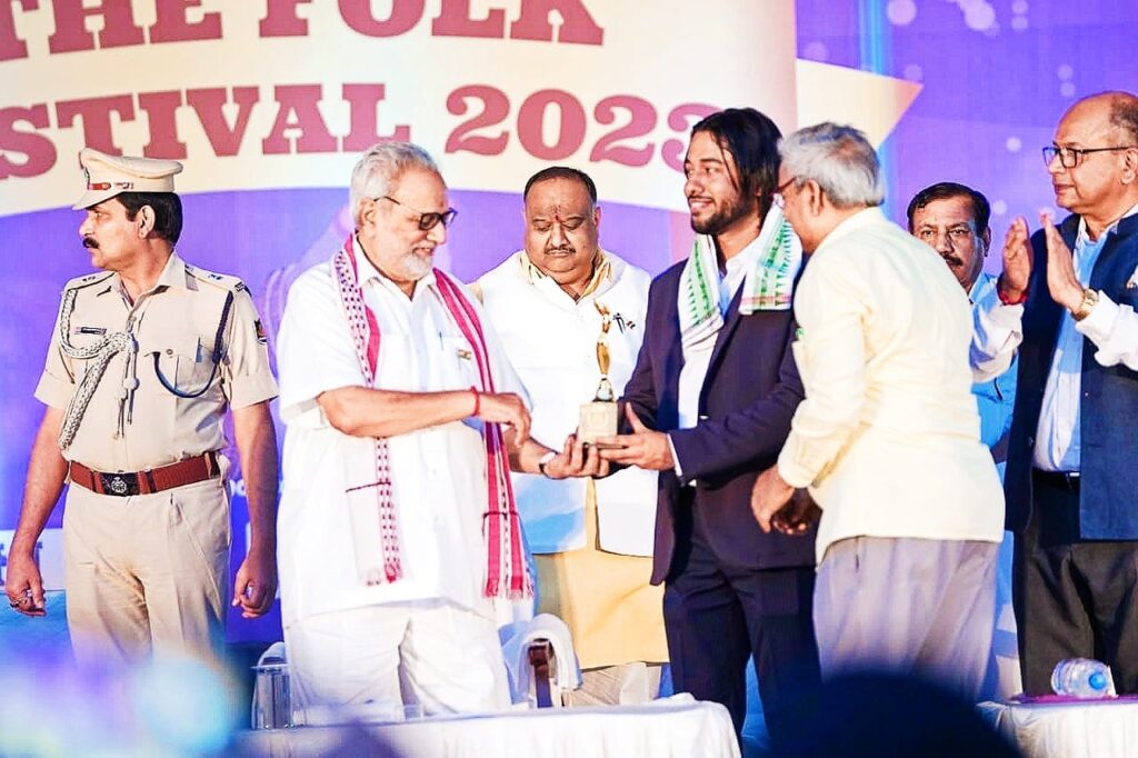 Dr. Pratabidya Parida receiving award from Governer of Odisha, Hon. Ganeshi Lal